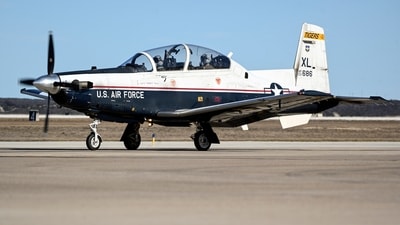 This image provided by the U.S. Air Force shows a U.S. Air Force T-6A Texan II taxiing down the flight line at Laughlin Air Force Base, Texas. The Air Force says an instructor pilot was killed when the ejection seat activated while the jet was still on the ground at Sheppard Air Force Base in Wichita Falls, Texas, when the seat activated during ground operations. (AP) This image provided by the U.S. Air Force shows a U.S. Air Force T-6A Texan II taxiing down the flight line at Laughlin Air Force Base, Texas. The Air Force says an instructor pilot was killed when the ejection seat activated while the jet was still on the ground at Sheppard Air Force Base in Wichita Falls, Texas, when the seat activated during ground operations. (AP)
