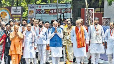 Prime Minister Narendra Modi accompanied by Union Home Minister Amit Shah, Bharatiya Janata Party (BJP) National President JP Nadda, Uttar Pradesh Chief Minister Yogi Adityanath and other NDA leaders greets supporters outside the DM office after filing his nomination papers for the Lok Sabha elections, in Varanasi on Tuesday. (ANI) Prime Minister Narendra Modi accompanied by Union Home Minister Amit Shah, Bharatiya Janata Party (BJP) National President JP Nadda, Uttar Pradesh Chief Minister Yogi Adityanath and other NDA leaders greets supporters outside the DM office after filing his nomination papers for the Lok Sabha elections, in Varanasi on Tuesday. (ANI)