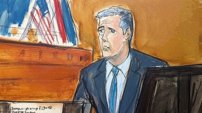 Michael Cohen testifies as a Wall Street Journal article is displayed on a screen in Manhattan criminal court, Tuesday, May 14, 2024, in New York. Donald Trump's fixer-turned-foe Michael Cohen returned to the witness stand Tuesday, testifying in detail how former president was linked to all aspects of a hush money scheme that prosecutors say was aimed at stifling stories that threatened his 2016 campaign. (Elizabeth Williams via AP) (AP) Michael Cohen testifies as a Wall Street Journal article is displayed on a screen in Manhattan criminal court, Tuesday, May 14, 2024, in New York. Donald Trump's fixer-turned-foe Michael Cohen returned to the witness stand Tuesday, testifying in detail how former president was linked to all aspects of a hush money scheme that prosecutors say was aimed at stifling stories that threatened his 2016 campaign. (Elizabeth Williams via AP) (AP)