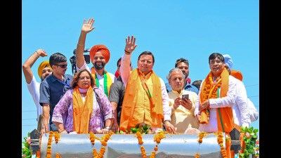 Uttarakhand chief minister Pushkar Singh Dhami during a roadshow in support of Subhash Sharma, BJP candidate from tge Anandpur Sahib constituency, in Rupnagar on Tuesday (ANI) Uttarakhand chief minister Pushkar Singh Dhami during a roadshow in support of Subhash Sharma, BJP candidate from tge Anandpur Sahib constituency, in Rupnagar on Tuesday (ANI)