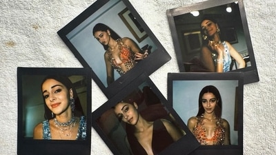 Another was a bunch of polaroids of her dressed in an orange, sequinned dress that looked stunning on her. Another was a bunch of polaroids of her dressed in an orange, sequinned dress that looked stunning on her.