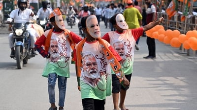 Attendees wear face masks featuring Narendra Modi, India's prime minister, ahead of a campaign rally in Varanasi, Uttar Pradesh, India, on Monday. (Prakash Singh/Bloomberg) Attendees wear face masks featuring Narendra Modi, India's prime minister, ahead of a campaign rally in Varanasi, Uttar Pradesh, India, on Monday. (Prakash Singh/Bloomberg)