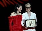 Meryl Streep (right) poses with French actor Juliette Binoche as she receives the Honorary Palme d'Or during the Opening Ceremony at the 77th edition of the Cannes Film Festival in Cannes, southern France, on May 14, 2024. (AFP)