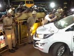 Karnataka JD(S) leader HD Revanna with officials of a Special Investigation Team. (PTI)