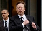 Tesla CEO Elon Musk and his security detail depart the company's local office in Washington, US.