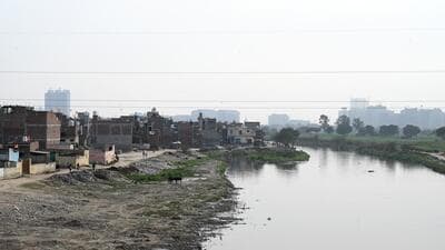 A view of illegal buildings on the Hindon floodplains near Kulesara. Officials at Gautam Budh Nagar administration said it was not possible to conduct rescue operations on a large scale in case of a flood and with monsoon approaching, the people residing in the restricted zone will be responsible for themselves and any damage caused to their establishments or houses. (Sunil Ghosh/HT Photo) A view of illegal buildings on the Hindon floodplains near Kulesara. Officials at Gautam Budh Nagar administration said it was not possible to conduct rescue operations on a large scale in case of a flood and with monsoon approaching, the people residing in the restricted zone will be responsible for themselves and any damage caused to their establishments or houses. (Sunil Ghosh/HT Photo)