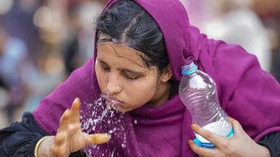 A woman splashes water on her face to get some respite from the scorching heat in Ahmedabad. (PTI Photo) A woman splashes water on her face to get some respite from the scorching heat in Ahmedabad. (PTI Photo)