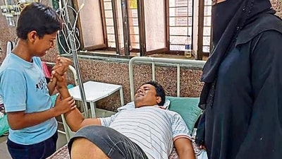 Bhiwandi resident Mohammed Arshad’s (38) right leg was fractured by the metal frame of the hoarding and he was also injured on his left leg. Presently admitted at the Rajawadi Hospital’s male ward on the ground floor, he said he was lucky to have survived the crash. (Raju Shinde/HT Photo) Bhiwandi resident Mohammed Arshad’s (38) right leg was fractured by the metal frame of the hoarding and he was also injured on his left leg. Presently admitted at the Rajawadi Hospital’s male ward on the ground floor, he said he was lucky to have survived the crash. (Raju Shinde/HT Photo)