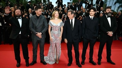 Cannes 2024: French actors Manuel Guillot, Raphael Quenard, Lea Seydoux, Vincent Lindon, Louis Garrel, and director Quentin Dupieux arrive for the Opening Ceremony and the screening of their film The Second Act. Lea looked resplendent in a thigh-high slit silver gown. (AFP) Cannes 2024: French actors Manuel Guillot, Raphael Quenard, Lea Seydoux, Vincent Lindon, Louis Garrel, and director Quentin Dupieux arrive for the Opening Ceremony and the screening of their film The Second Act. Lea looked resplendent in a thigh-high slit silver gown. (AFP)