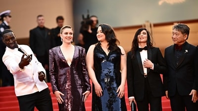 (FromL) Members of the Jury of the 77th Cannes Film Festival, French actor Omar Sy, US director and president of the Jury of the 77th Cannes Film Festival Greta Gerwig, US actress Lily Gladstone, Lebanese director Nadine Labaki, Japanese director Hirokazu Kore-eda and Turkish writer and photographer Ebru Ceylan pose as they arrive for the Opening Ceremony and the screening of the film "Le Deuxieme Acte" at the 77th edition of the Cannes Film Festival in Cannes, southern France, on May 14, 2024. (Photo by LOIC VENANCE / AFP) (AFP) (FromL) Members of the Jury of the 77th Cannes Film Festival, French actor Omar Sy, US director and president of the Jury of the 77th Cannes Film Festival Greta Gerwig, US actress Lily Gladstone, Lebanese director Nadine Labaki, Japanese director Hirokazu Kore-eda and Turkish writer and photographer Ebru Ceylan pose as they arrive for the Opening Ceremony and the screening of the film "Le Deuxieme Acte" at the 77th edition of the Cannes Film Festival in Cannes, southern France, on May 14, 2024. (Photo by LOIC VENANCE / AFP) (AFP)