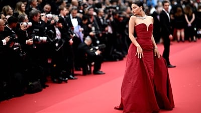 Cannes 2024: Australian model Shanina Shaik poses for the media on Day 1 of Cannes Film Festival. She wore a corseted red gown for the opening ceremony. (AFP) Cannes 2024: Australian model Shanina Shaik poses for the media on Day 1 of Cannes Film Festival. She wore a corseted red gown for the opening ceremony. (AFP)