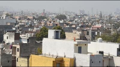 Residential buildings at Gurugram Sector-12 where additional floors have been built illegally i violation of DTCP norms. (Parveen Kumar/HT PHOTO)