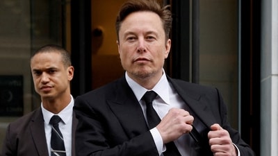 Tesla CEO Elon Musk and his security detail depart the company's local office in Washington, US. (Reuters)