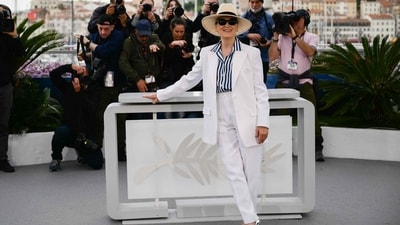 Cannes 2024: Meryl Streep poses during a photocall before receiving the Honorary Palme d'Or at the 77th edition of the Cannes Film Festival in Cannes. She wore a white suit, straw hat, and a striped shirt for the occasion. (AFP) Cannes 2024: Meryl Streep poses during a photocall before receiving the Honorary Palme d'Or at the 77th edition of the Cannes Film Festival in Cannes. She wore a white suit, straw hat, and a striped shirt for the occasion. (AFP)