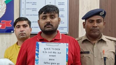 The suspect in railway police’s custody on Wednesday. During interrogation, the suspect told police that he has sold tickets worth ₹8 lakh in the last eight years. (HT Photo) The suspect in railway police’s custody on Wednesday. During interrogation, the suspect told police that he has sold tickets worth ₹8 lakh in the last eight years. (HT Photo)
