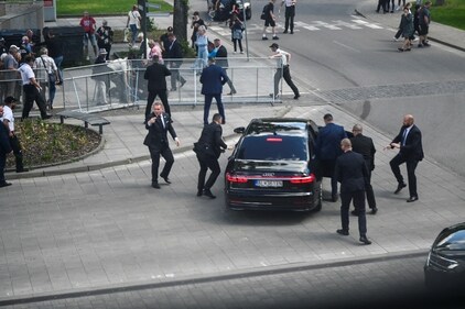 Security officers move Slovak PM Robert Fico in a car after a shooting incident, after a Slovak government meeting in Handlova, Slovakia, May 15, 2024. (REUTERS)