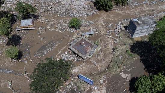 This drone shot shows buildings damaged by a flash flood in Tanah Datar, West Sumatra, Indonesia.(AP)