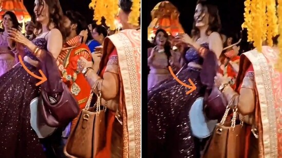 The image, taken from a viral video, shows a dhol player lifting a woman. (X/@divya_gandotra)