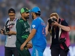 Pakistan's Babar Azam shakes hands with India's Rohit Sharma.