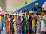 Voters display identity cards while standing in queue to cast their votes during the 4th phase of general elections, in Berhampur, Odisha Voters display identity cards while standing in queue to cast their votes during the 4th phase of general elections, in Berhampur, Odisha