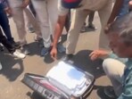 Police and election officials inspecting Eknath Shinde's bags on Thursday.(PTI)