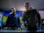 Ukraine's President Volodymyr Zelensky (L) listening to Pavlo Fedosenko (R), commander of the 92nd separate assault brigade named after Ivan Sirko, during his visit to Kharkiv. 