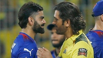 Royal Challengers Bengaluru's Virat Kohli and Chennai Super Kings' MS Dhoni exchange handshakes. (ANI  )