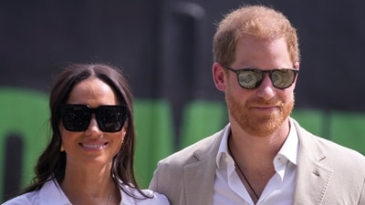 Meghan Markle was seen ‘striding off’ from Prince Harry in LA (AP Photo/Sunday Alamba) (AP) Meghan Markle was seen ‘striding off’ from Prince Harry in LA (AP Photo/Sunday Alamba) (AP)