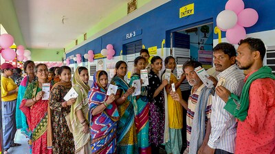 Voters display identity cards while standing in queue to cast their votes during the 4th phase of general elections, in Berhampur, Odisha (PTI) Voters display identity cards while standing in queue to cast their votes during the 4th phase of general elections, in Berhampur, Odisha (PTI)
