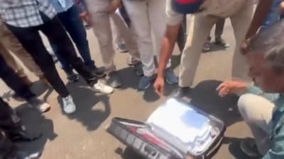 Police and election officials inspecting Eknath Shinde's bags on Thursday. (PTI) Police and election officials inspecting Eknath Shinde's bags on Thursday. (PTI)