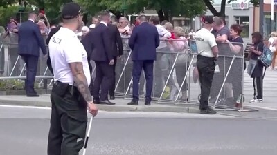 A man aims a handgun at Slovakia's Prime Minister Robert Fico as he was approaching people after a Slovak government meeting in Handlova, Slovakia, May 15, 2024  in this screen grab from a video. (Reuters)