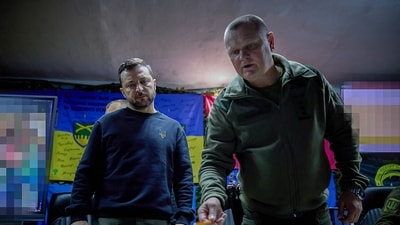 Ukraine's President Volodymyr Zelensky (L) listening to Pavlo Fedosenko (R), commander of the 92nd separate assault brigade named after Ivan Sirko, during his visit to Kharkiv. (AFP) Ukraine's President Volodymyr Zelensky (L) listening to Pavlo Fedosenko (R), commander of the 92nd separate assault brigade named after Ivan Sirko, during his visit to Kharkiv. (AFP)
