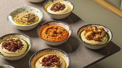 A varied range of hummus laid on a table (Instagram)