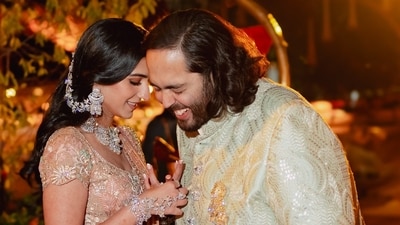 Radhika Merchant and Anant Ambani sharing a laughter-filled moment. Radhika Merchant and Anant Ambani sharing a laughter-filled moment.