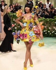 Nicki Minaj was stunning in her vibrant yellow mini dress with metal flowers and eye-catching arched ponytail (Shutterstock)