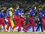 Royal Challengers Bengaluru's bowler Cameron Green with teammates celebrates the wicket of Chennai Super Kings' batter Daryl Mitchell during the Indian Premier League (IPL) 2024 cricket match 