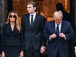 Former US President Donald Trump (R) stands with his wife Melania Trump (2L) their son Barron Trump (C) and father-in-law Viktor Knavs in Palm Beach, Florida. Former US President Donald Trump (R) stands with his wife Melania Trump (2L) their son Barron Trump (C) and father-in-law Viktor Knavs in Palm Beach, Florida.