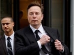 FILE PHOTO: Tesla CEO Elon Musk and his security detail leave the company’s local office in Washington, U.S. January 27, 2023.  REUTERS/Jonathan Ernst/File Photo
