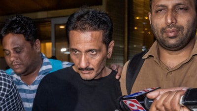 Crime Branch Team arrived along with the accused Bhavesh Bhinde at Mumbai International Airport, Bhinde, the owner of the advertising firm, The 120x120-foot advertising hoarding set up by Bhinde's company in Pant Nagar collapsed on May 13 in Mumbai, India, (Hindustan Times) Crime Branch Team arrived along with the accused Bhavesh Bhinde at Mumbai International Airport, Bhinde, the owner of the advertising firm, The 120x120-foot advertising hoarding set up by Bhinde's company in Pant Nagar collapsed on May 13 in Mumbai, India, (Hindustan Times)