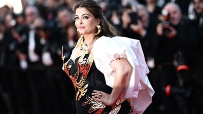 Aishwarya Rai was recently spotted at the Mumbai airport as she travelled to Cannes with Aaradhya. Before boarding the flight, she happily posed for the paparazzi at the airport and greeted them with a smile. She was seen sporting an arm sling on her right hand, raising concerns among fans regarding her injury. (AFP) Aishwarya Rai was recently spotted at the Mumbai airport as she travelled to Cannes with Aaradhya. Before boarding the flight, she happily posed for the paparazzi at the airport and greeted them with a smile. She was seen sporting an arm sling on her right hand, raising concerns among fans regarding her injury. (AFP)