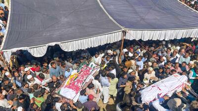 Awami Action Committee's Kashmiris carry the coffins of slain protestors during the funeral in Muzaffarabad, the capital of Pakistan-occupied Kashmir (PoK) on May 14. (AFP) Awami Action Committee's Kashmiris carry the coffins of slain protestors during the funeral in Muzaffarabad, the capital of Pakistan-occupied Kashmir (PoK) on May 14. (AFP)