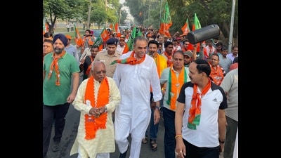 BJP candidate Sanjay Tandon during a foot march with party workers in Chandigarh on Friday. (HT Photo) BJP candidate Sanjay Tandon during a foot march with party workers in Chandigarh on Friday. (HT Photo)