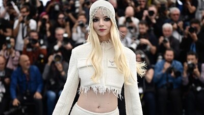 British-US actress Anya Taylor-Joy dazzled during a photocall for the film "Furiosa: A Mad Max Saga." The actress appeared ethereal in a breathtaking white cropped jacket with a fringed hemline, paired with matching bottoms. Her ensemble was completed with a matching cap adorned with fringes, complemented by bold red lips and smokey eyeshadow, truly slaying the red carpet glamour. (Photo by LOIC VENANCE / AFP) British-US actress Anya Taylor-Joy dazzled during a photocall for the film "Furiosa: A Mad Max Saga." The actress appeared ethereal in a breathtaking white cropped jacket with a fringed hemline, paired with matching bottoms. Her ensemble was completed with a matching cap adorned with fringes, complemented by bold red lips and smokey eyeshadow, truly slaying the red carpet glamour. (Photo by LOIC VENANCE / AFP)