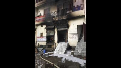 Piles of wood and furniture articles, worth around  ₹25 lakh, were gutted in the fire that was reported around 2 am. (HT Photo)