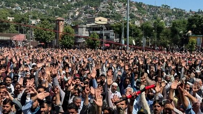 People chant slogans while attending the funeral of people who were killed during protests in Muzaffarabad, Pakistan-occupied Kashmir, on May 14. (Reuters)