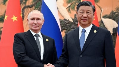 Russian President Vladimir Putin with Chinese President Xi Jinping (via REUTERS)
