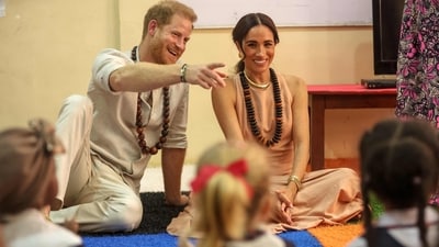 Prince Harry and Meghan Markle on their trip to Nigeria. (Photo by Kola SULAIMON / AFP) (AFP) Prince Harry and Meghan Markle on their trip to Nigeria. (Photo by Kola SULAIMON / AFP) (AFP)