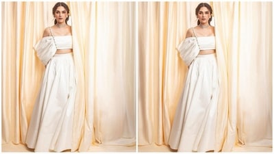 Her outfit comes in a stunning ivory shade and features a crop top with thin straps and oversized dramatic sleeves. She paired it with a matching flared skirt, which complemented her look perfectly and added a touch of sartorial flair. (Instagram/@aditiraohydari) Her outfit comes in a stunning ivory shade and features a crop top with thin straps and oversized dramatic sleeves. She paired it with a matching flared skirt, which complemented her look perfectly and added a touch of sartorial flair. (Instagram/@aditiraohydari)