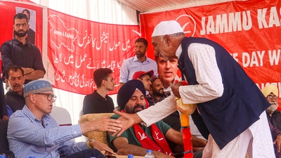 Jammu and Kashmir National Conference (JKNC) Vice President and party candidate Omar Abdullah is greeted by a party worker during an election rally at Magam in Budgam district, UT of Jammu and Kashmir. (PTI) Jammu and Kashmir National Conference (JKNC) Vice President and party candidate Omar Abdullah is greeted by a party worker during an election rally at Magam in Budgam district, UT of Jammu and Kashmir. (PTI)