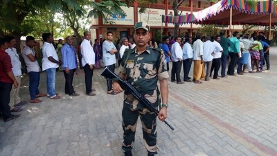 Tirupati, May 13 (ANI): Security personnel stand guard as voters wait in queues to cast their votes for the Andhra Pradesh Assembly polls and Lok Sabha elections 2024, at a polling booth, at Sullurupeta in Tirupati on Monday. (ANI Photo) (Lakshmi) Tirupati, May 13 (ANI): Security personnel stand guard as voters wait in queues to cast their votes for the Andhra Pradesh Assembly polls and Lok Sabha elections 2024, at a polling booth, at Sullurupeta in Tirupati on Monday. (ANI Photo) (Lakshmi)